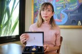 Woman holding medal