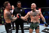 Dustin Poirier (left) shakes hands with Conor McGregor after winning their UFC 257 bout in Abu Dhabi.